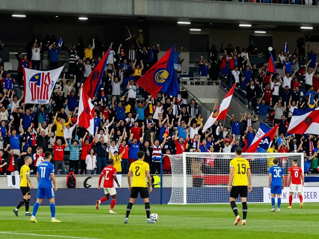 Exciting trực tiếp bóng đá scene with fans cheering in a stadium during a thrilling match in 2026.